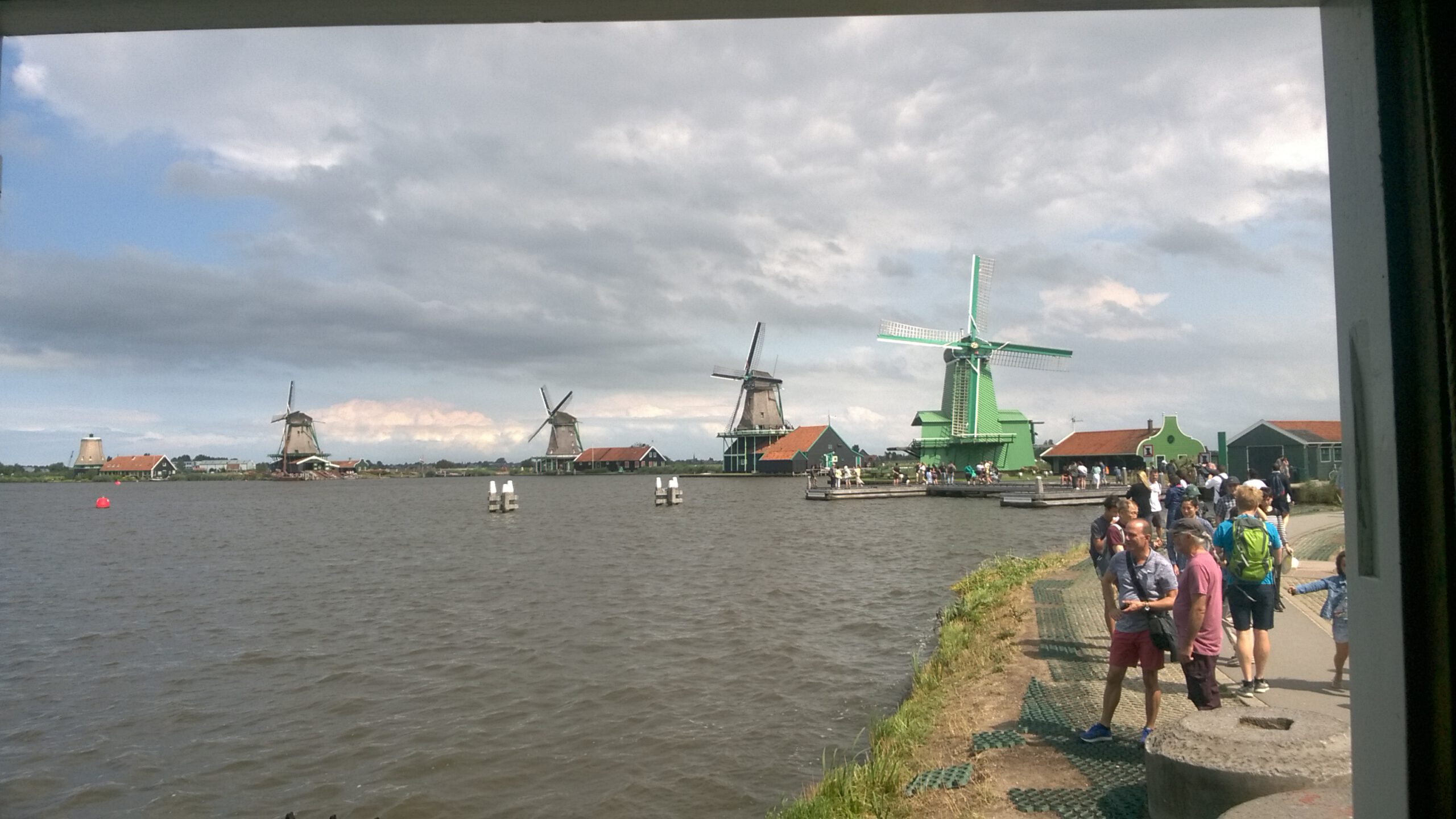 Which is more cheaper to visit Kinderdijk or Zaanse schans?